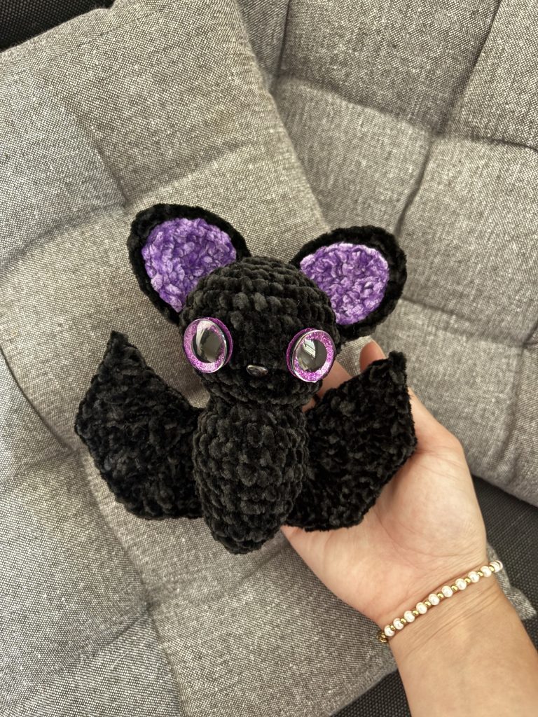 hand holding crochet amigurumi bat