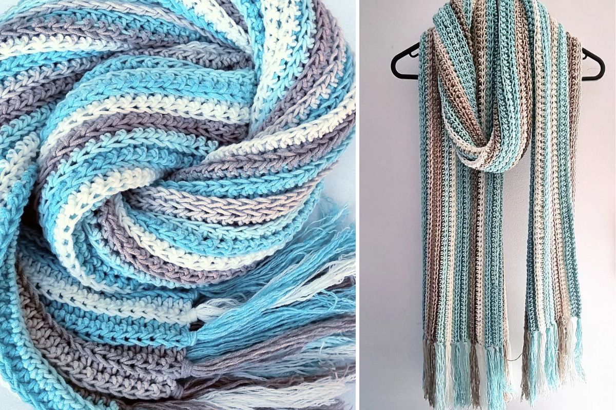 Crocheted scarf with vertical stripes in blue, white, and beige tones, featuring fringe at the ends, shown coiled and hanging on a hanger.
