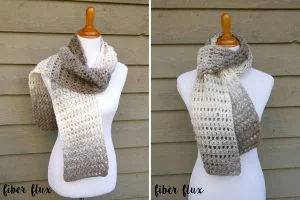 A white mannequin displays a crocheted scarf in gradient shades of cream, gray, and brown, shown from two different angles against a wooden background.