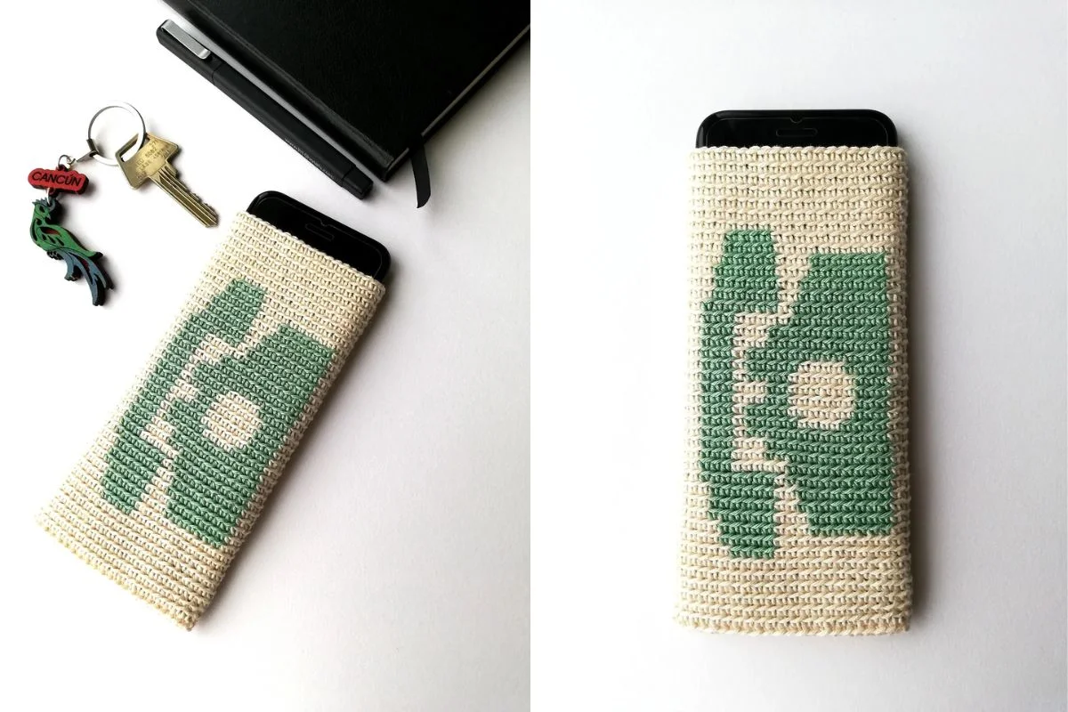 A smartphone in a beige woven case with a green abstract pattern, shown from different angles on a white surface next to a notebook, keys, and a tiny crocheted snowman for a cozy touch.