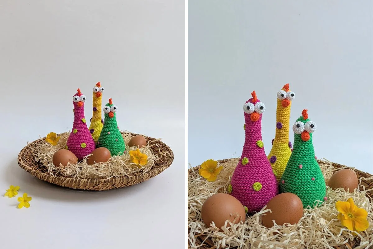 Three colorful crocheted chickens and four brown eggs are arranged on straw in a woven basket, with yellow flowers scattered around.
