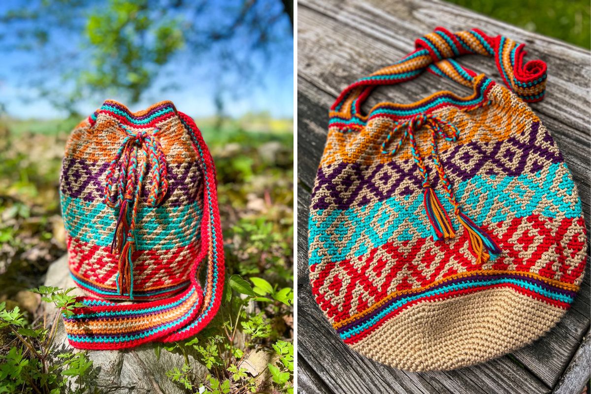 A colorful, crochet drawstring bag with geometric patterns sits outdoors on a wooden surface and on grass.