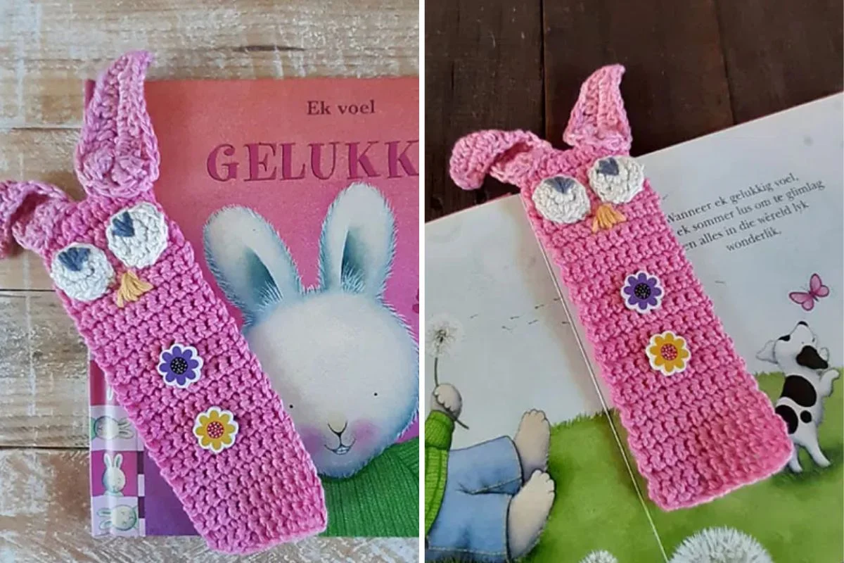 Crocheted pink bunny bookmark with white eyes, floral decorations, and long ears, placed on illustrated children's books.