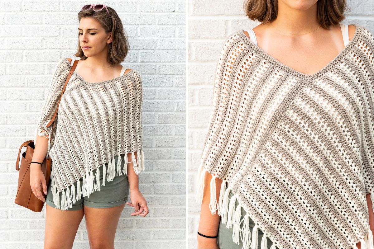 A person wearing a crochet poncho with fringe, green shorts, a brown shoulder bag, and sunglasses, standing against a white brick wall.