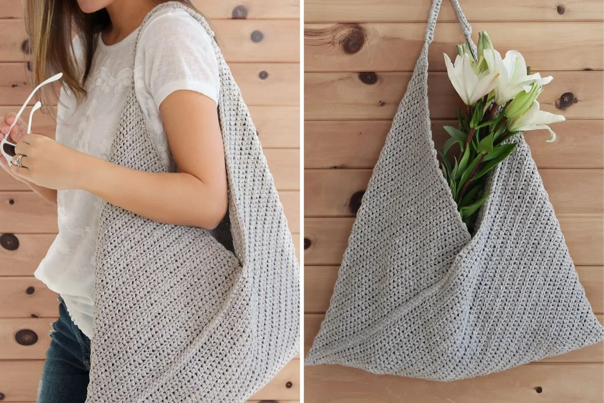 A person wears a large, gray, hand-crocheted Miller Market Bag over their shoulder; on the right, the bag holds white lilies against a wooden background.