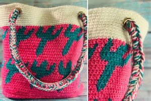 A crocheted tote bag with a pink and cream base, teal cactus pattern, and braided rope handles.