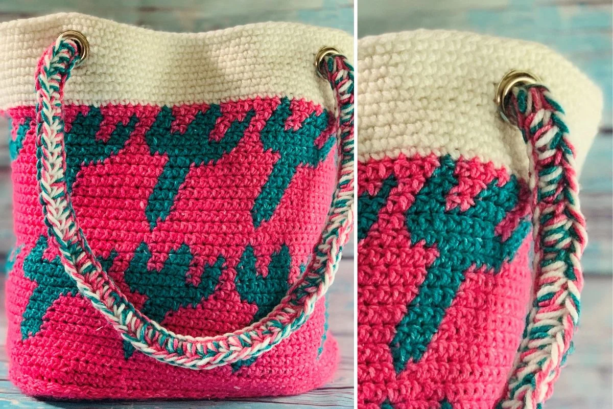 A crocheted tote bag with a pink and cream base, teal cactus pattern, and braided rope handles.