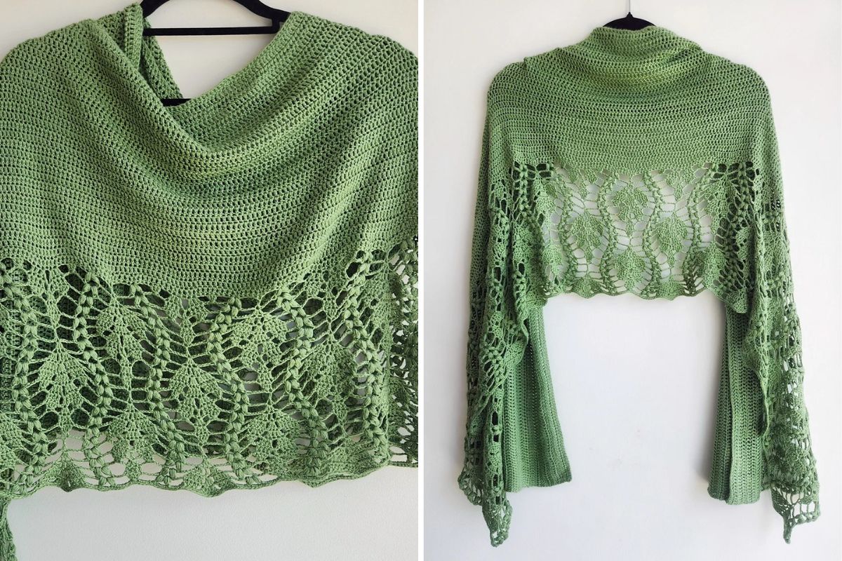 a green crocheted shawl with an intricate leaf-shaped lacy pattern at the bottom