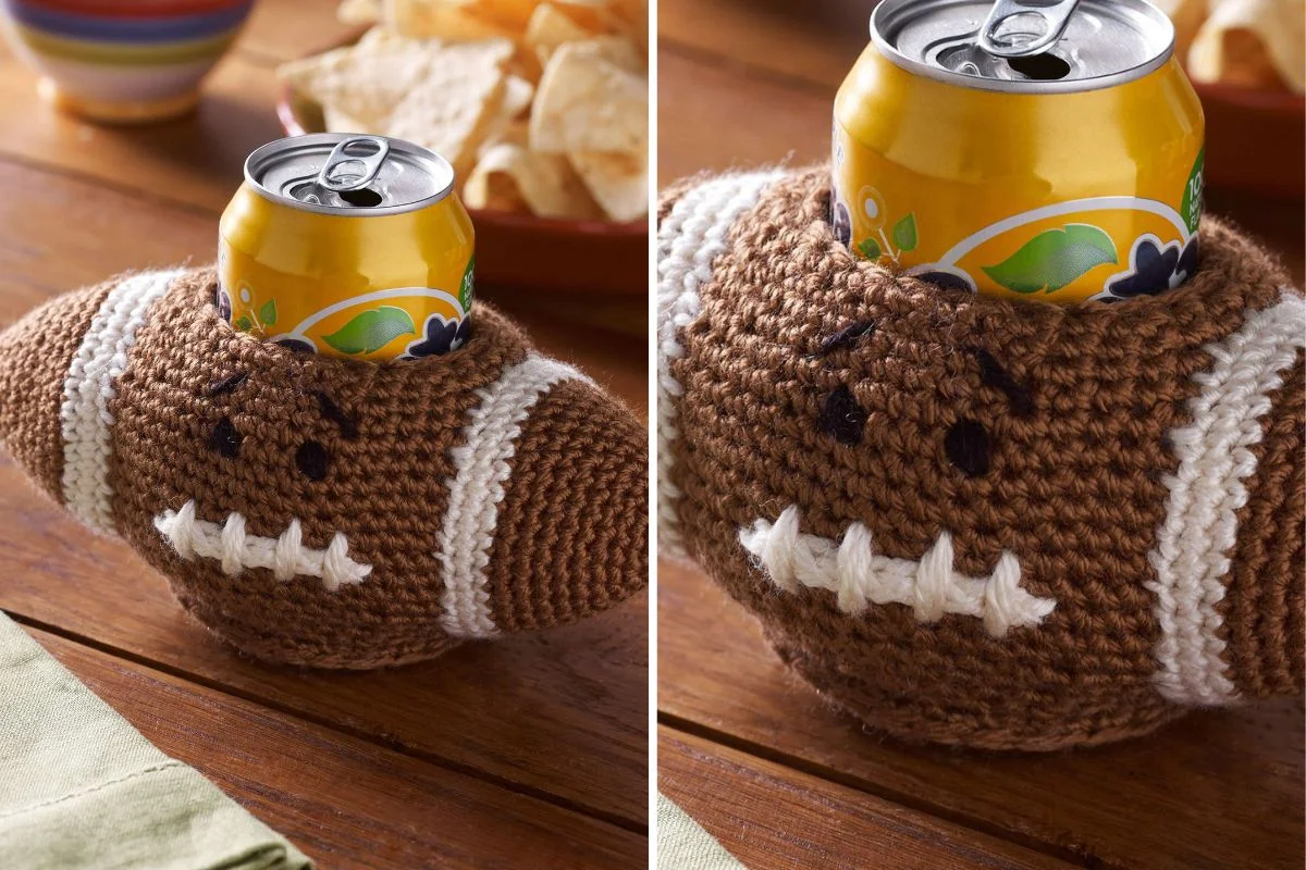 A Football Can Cozy, crocheted in the shape of a football, holds a soda can on a wooden table, with a bowl of chips in the background.