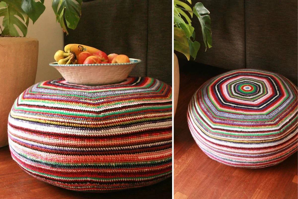 A round, stripey pouf featuring multicolored crochet stripes sits on a wooden floor; in one image, a bowl of fruit rests on top.