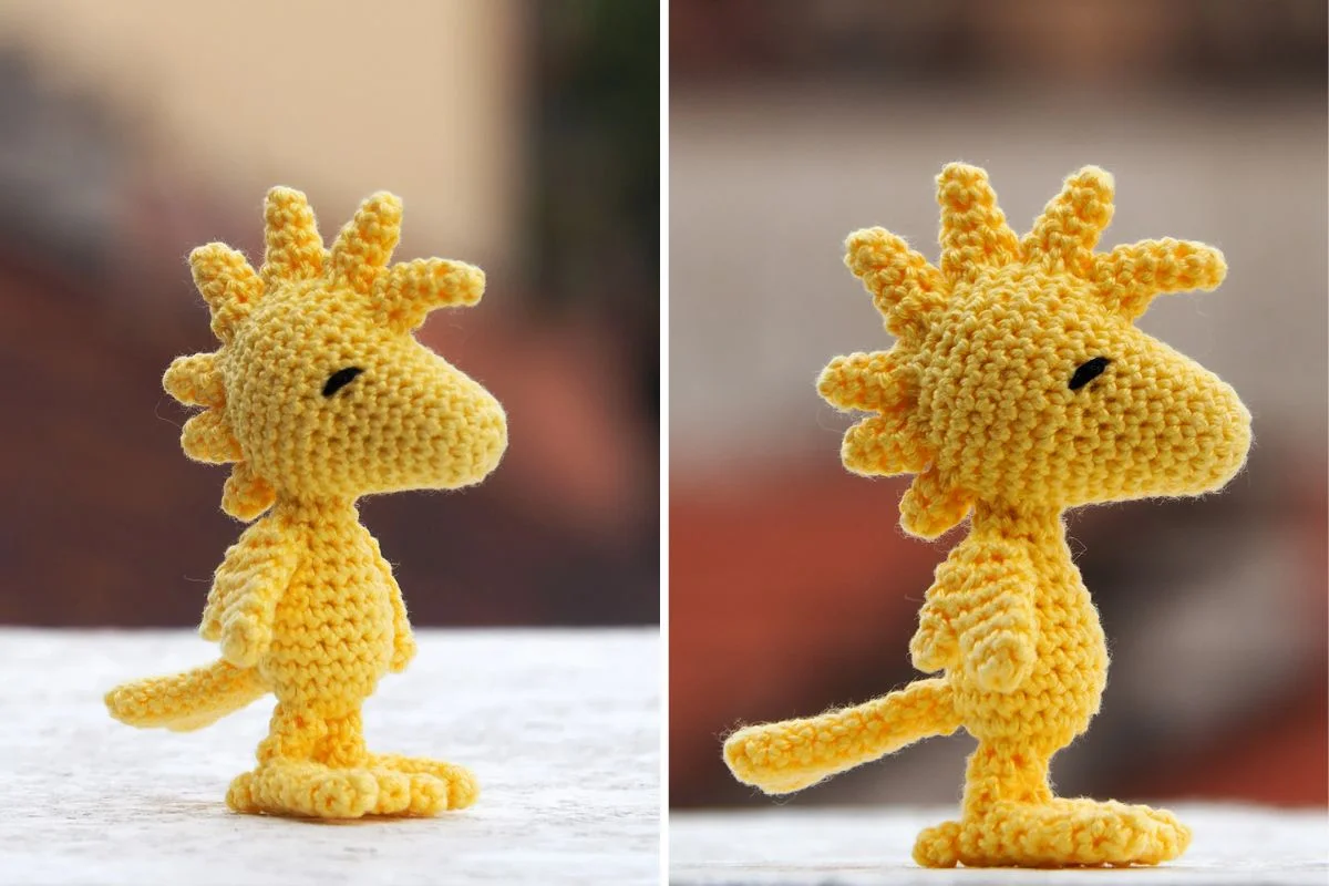 Two side views of an Amigurumi Woodstock crocheted yellow bird plush toy with spiky head feathers, standing upright on a white surface against a blurred background.