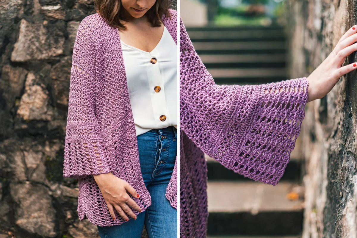 A woman wearing a purple Hydrangea Cardigan crochet cardigan over a white buttoned top and blue jeans stands near a stone wall, with a close-up of the sleeve detail on the right.