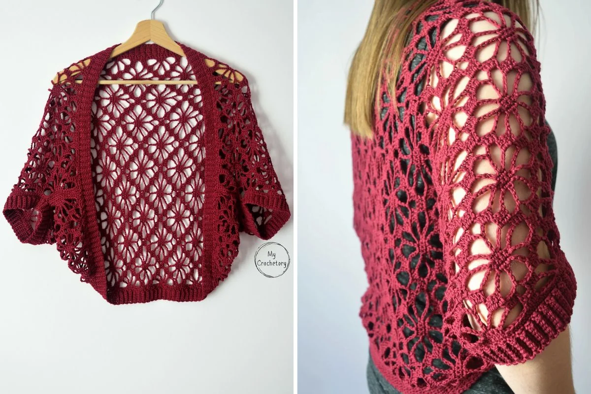 A burgundy, openwork crochet cardigan is shown on a hanger and worn by a person, highlighting the lace-like floral pattern and short sleeves.