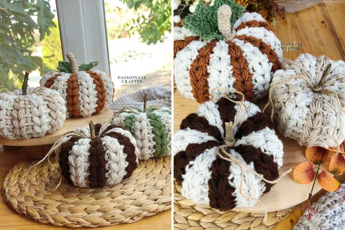 Four crocheted Farmhouse Braids Pumpkins in cream, brown, and green colors are displayed on a woven mat and wooden surface near a window, with outdoor greenery in the background.