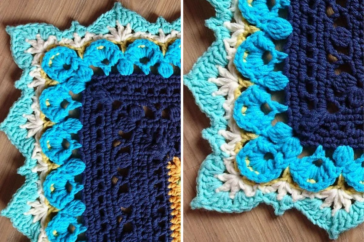 Close-up of a crocheted item with a star-shaped edge, featuring blue, turquoise, yellow, and white yarn on a wooden surface.