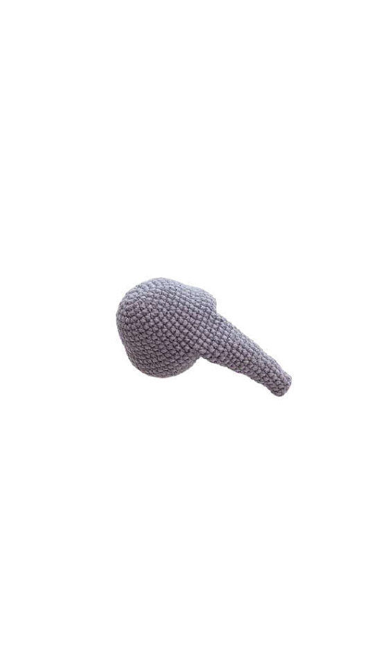 A grey, spherical elephant amigurumi with a crocheted, protruding extension.