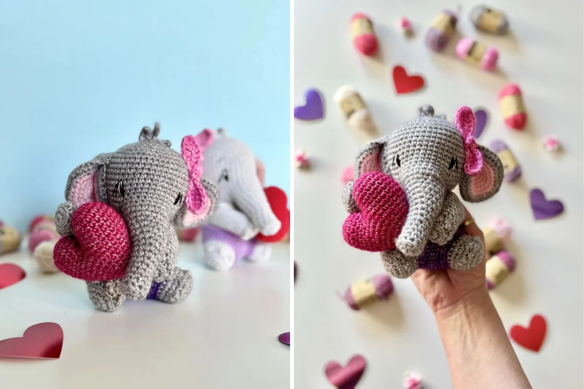 Two crochet elephants with pink bows holding stuffed red hearts, surrounded by small yarn skeins and paper hearts.