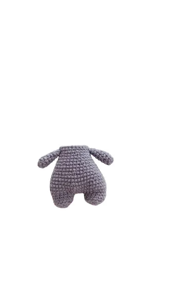 A headless, purple crocheted plush torso with two arms and legs, crafted using a crochet pumpkin pattern.