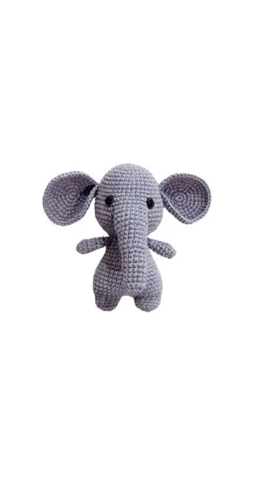 A small, light-purple elephant amigurumi toy with large ears and black bead eyes.