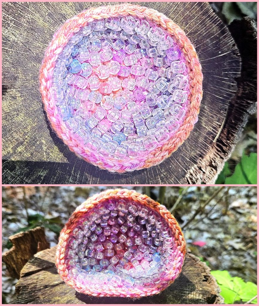 A small, round, crochet geode bowl filled with iridescent beads, shown from top and side angles.
