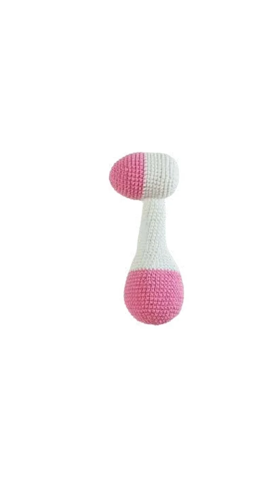 A crochet pumpkin pattern rattle toy with a white handle and a pink and white top section.