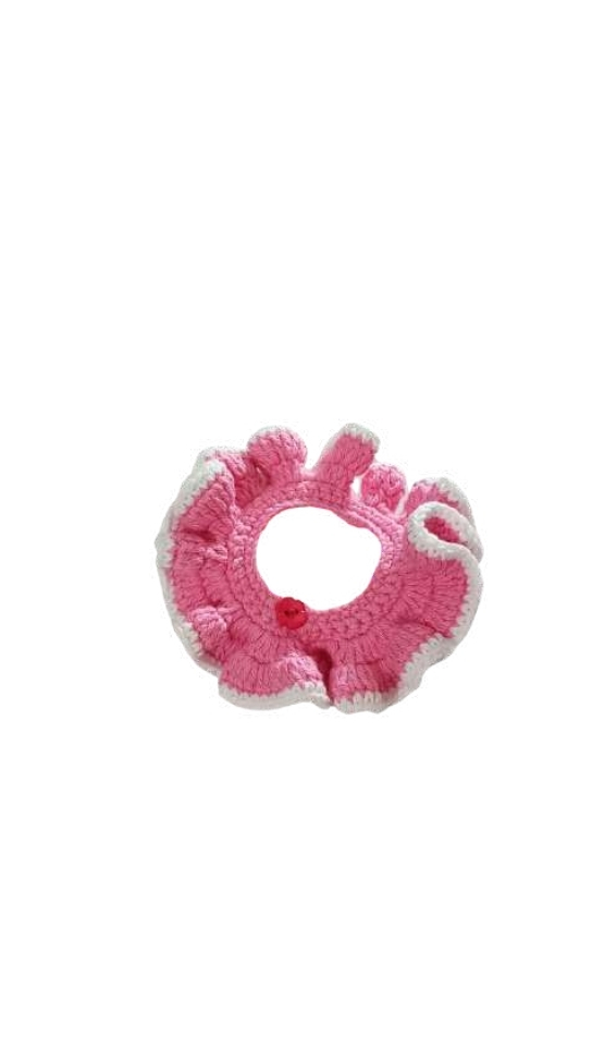 Pink crocheted ruffled pet collar with a white border and a single red button, a festive accessory often paired with a crochet pumpkin pattern.